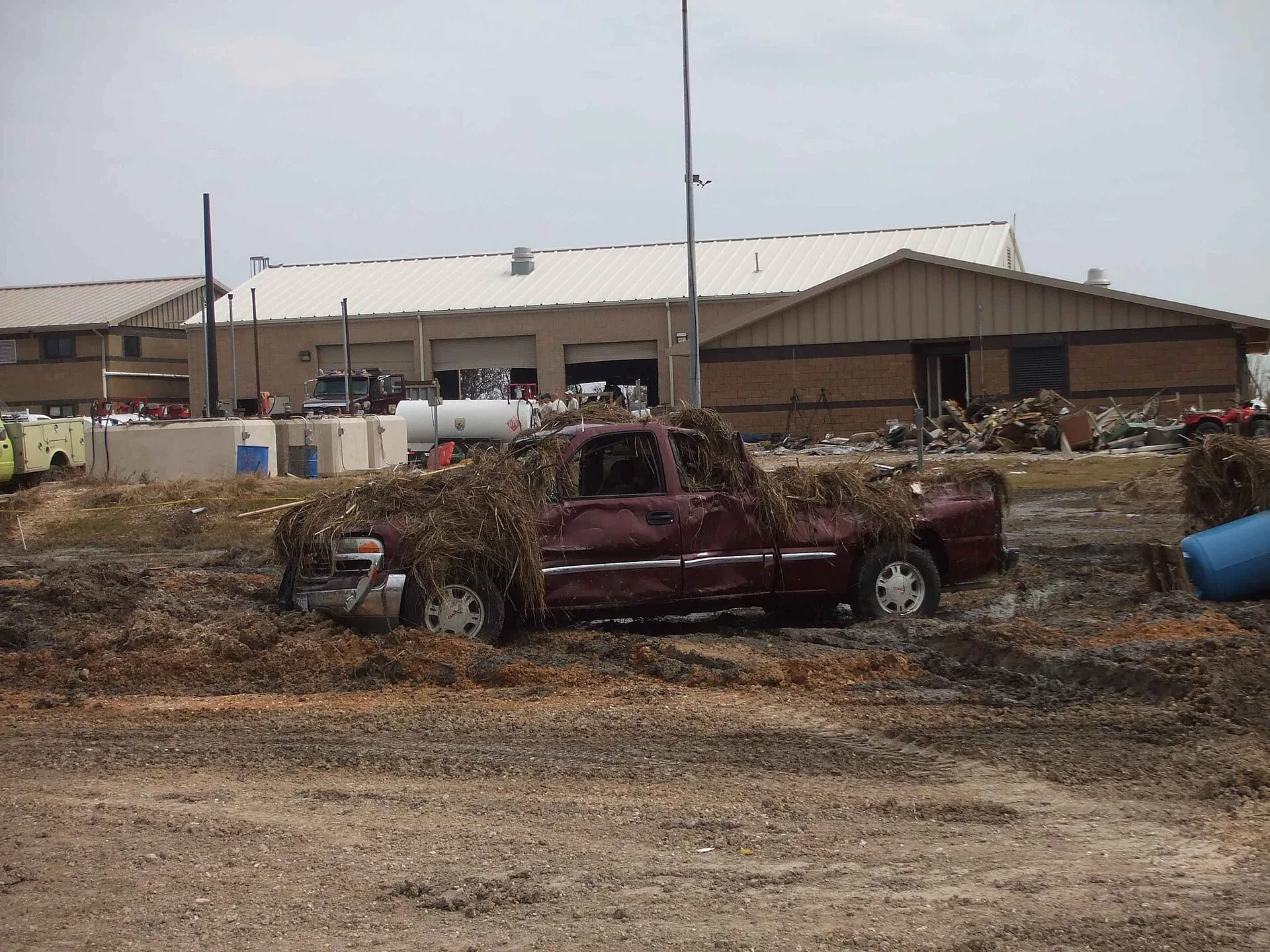 Image title: This truck and building sustained damage from the force of hurricane Image from Public domain images website, http://www.public-domain-image.com/full-image/events-happenings-public-domain-images-pictures/this-truck-and-building-sustained-damage-from-the-force-of-hurricane.jpg.html. Miami commercial property and business interruption coverage after a hurricane
